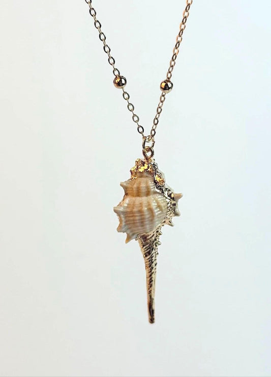 Shell pendant necklace on a light gray background