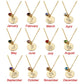 Gold necklaces with circular pendants for each month of the year on a white background.