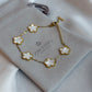 Gold bracelet with floral designs on a branded box