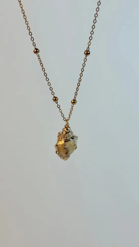 Necklace with a small pendant on a light gray background