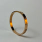 Gold bracelet with embedded zircon stones